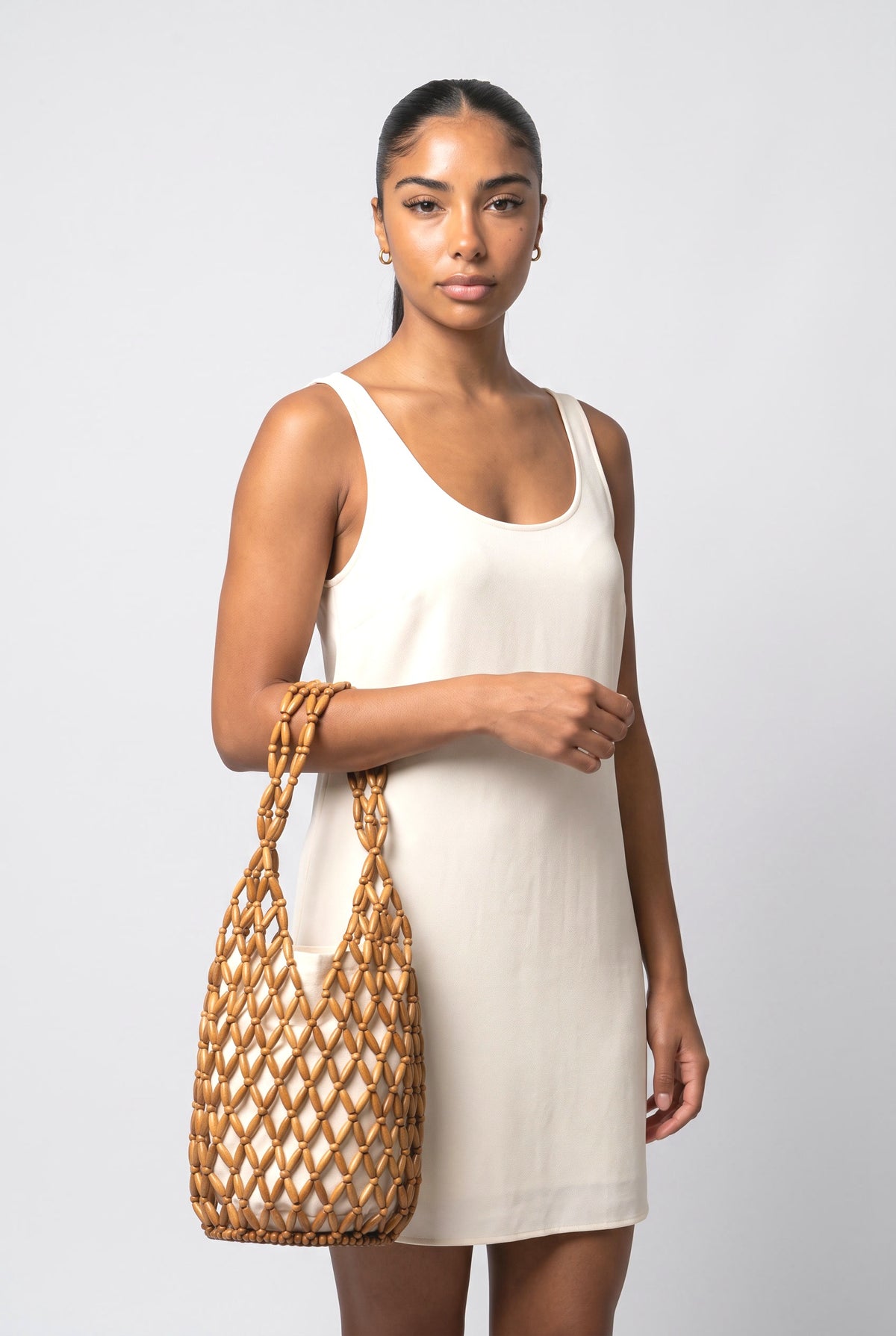Hollow Woven Bucket Bag, worn, shown to scale
