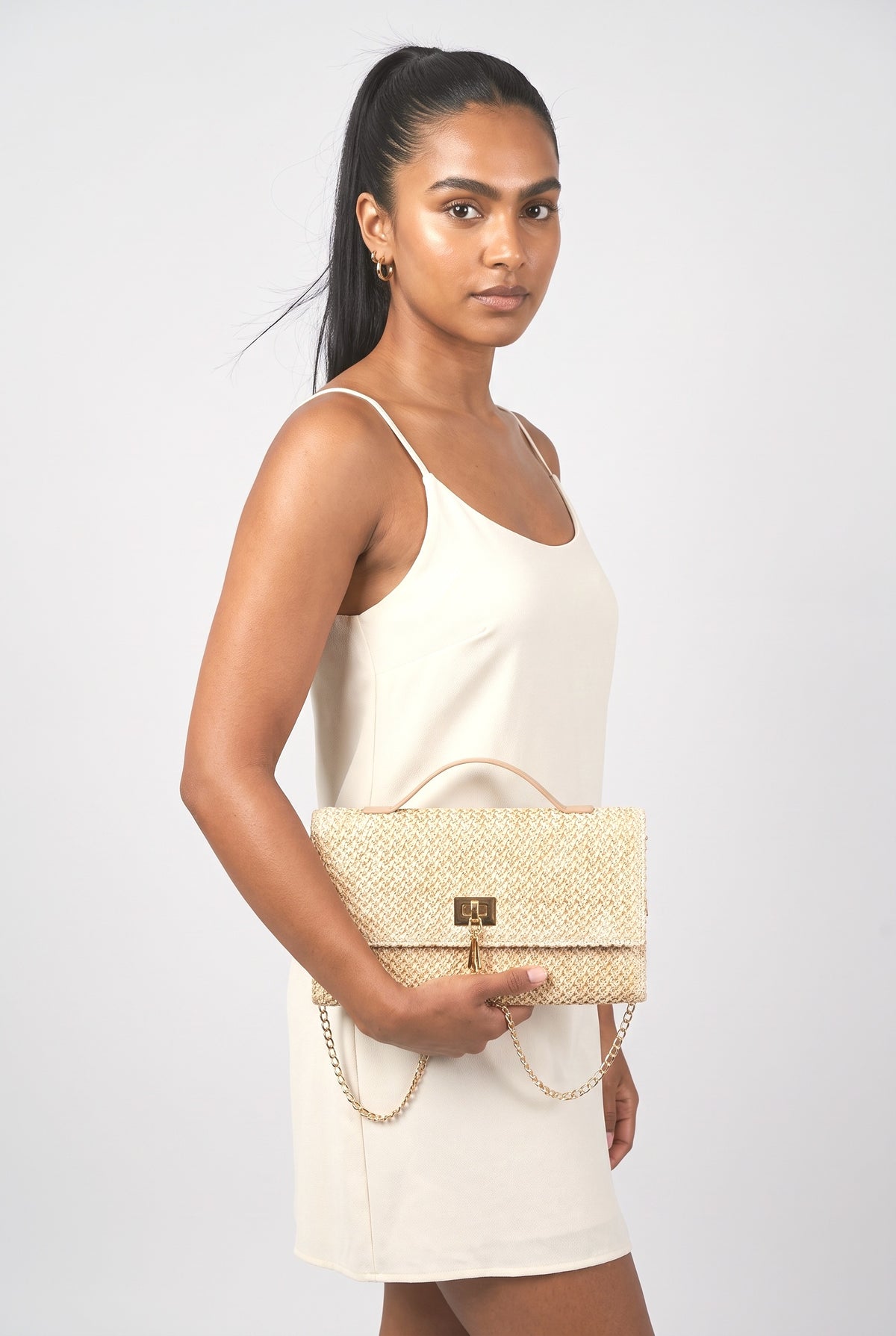 Rectangular Straw Woven Top Handle Clutch Crossbody Bag, worn, shown to scale