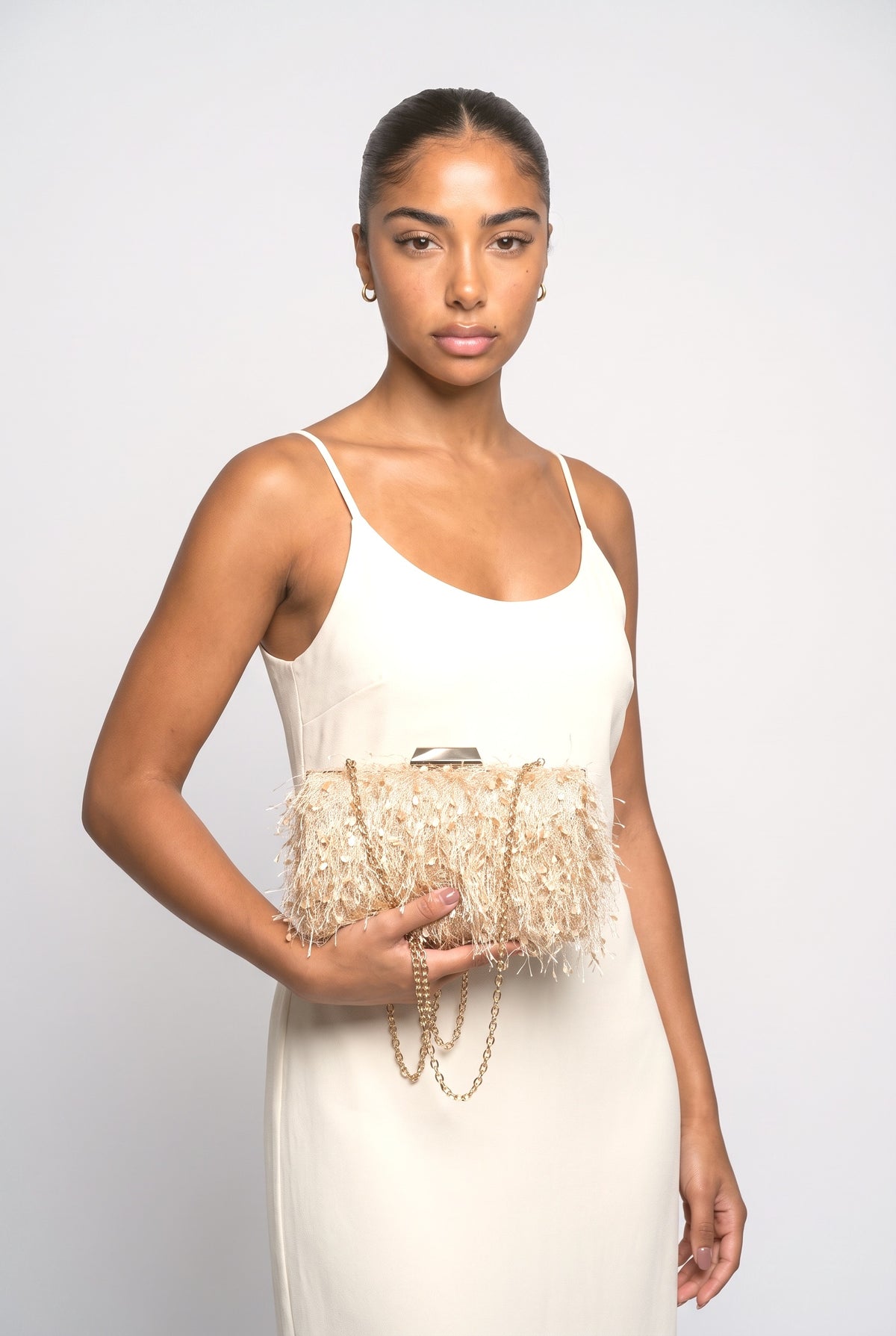 Tassel Clutch Chain Bag, worn, shown to scale