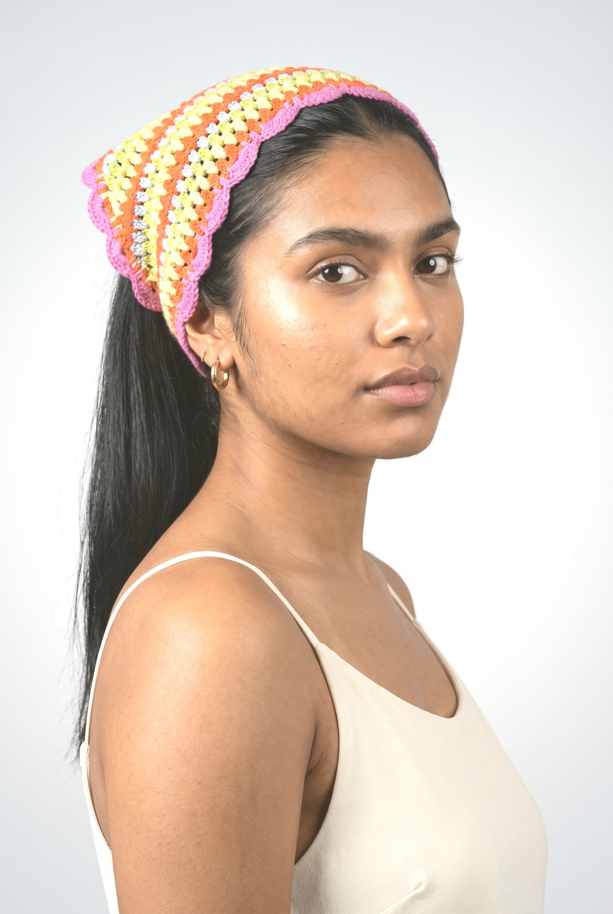 Hand Crochet Rainbow Bandana, worn, shown to scale