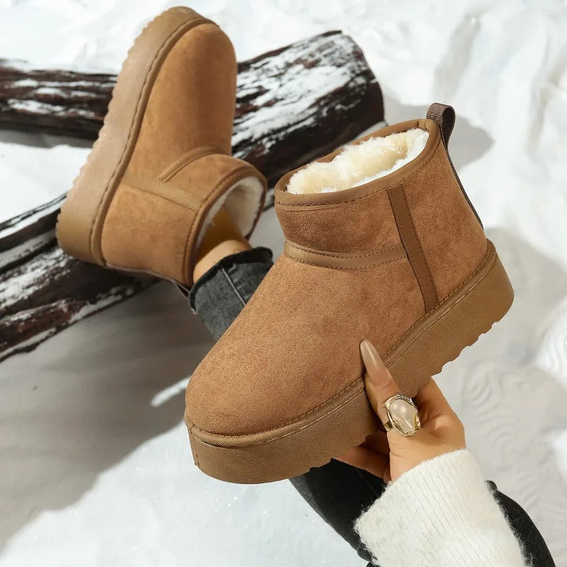 Camel platform mini boot held in hand, showing the plush collar
