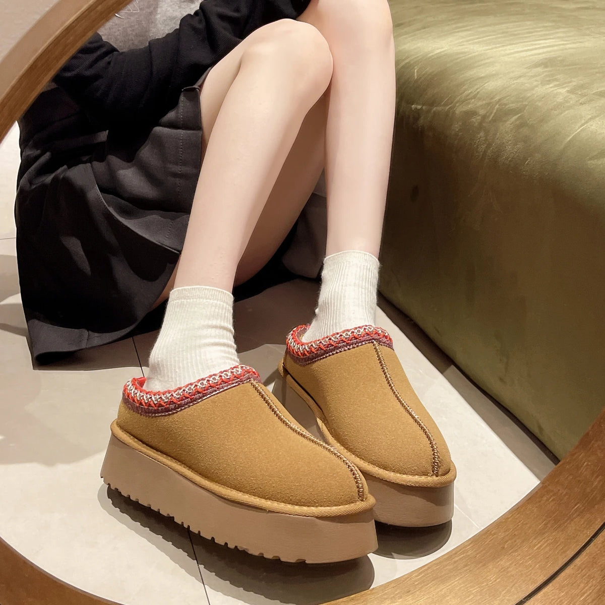 Tan platform slippers worn with ankle socks