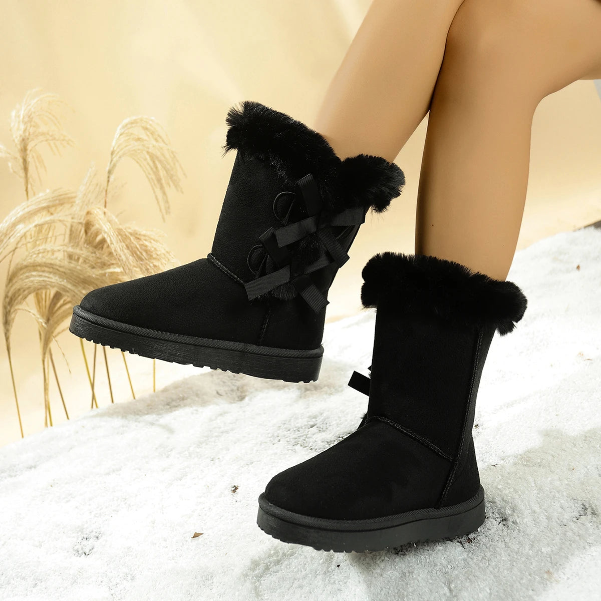 Black bow snow boots, mid calf