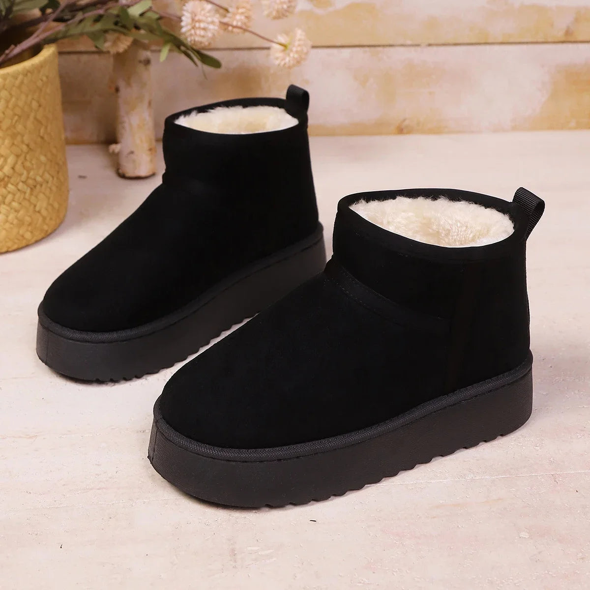 Black platform mini boots, side view